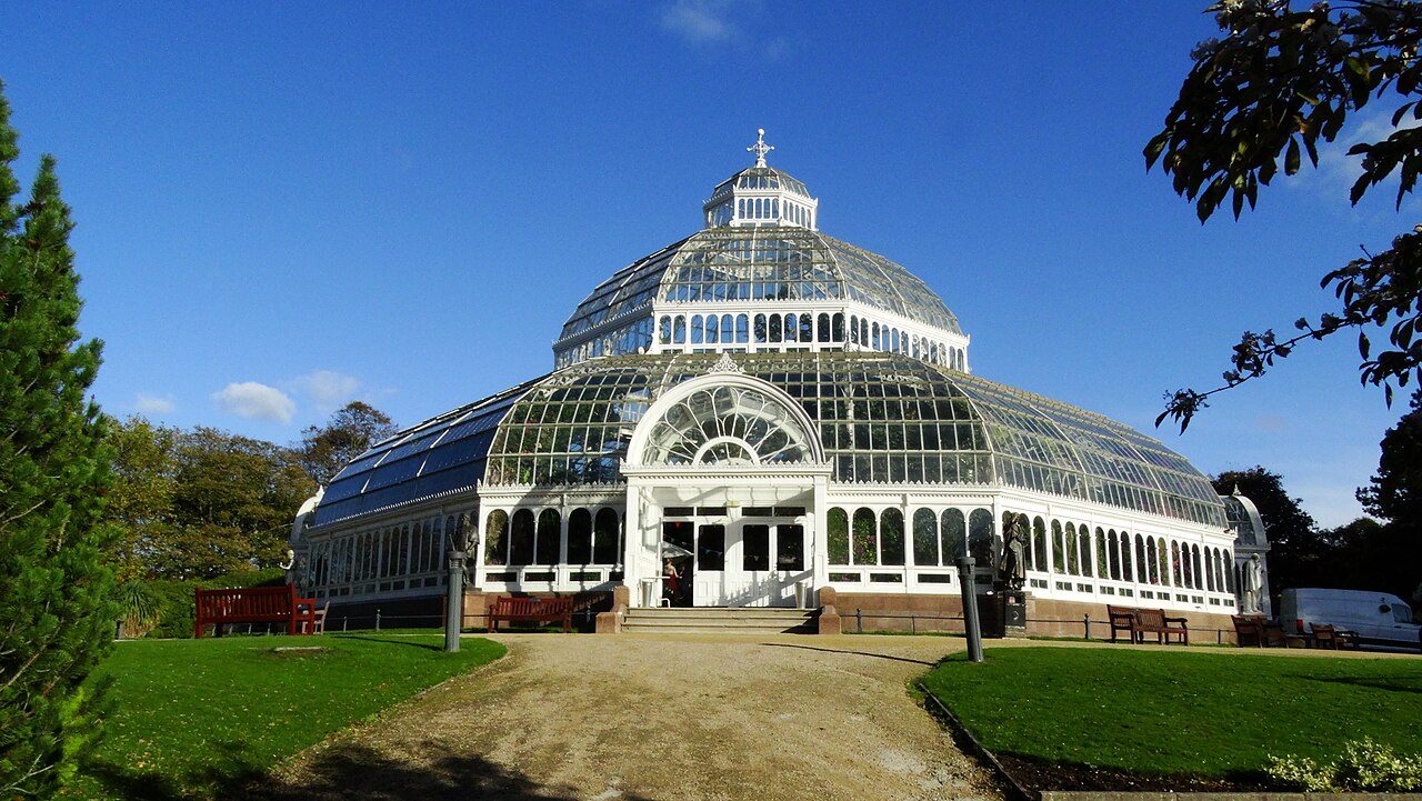 The glass dome of Sefton Park Palm House on a sunny day