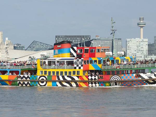 The Mersey Ferry Snowdrop in its dazzle paint on the river, with the Liverpool waterfront behind