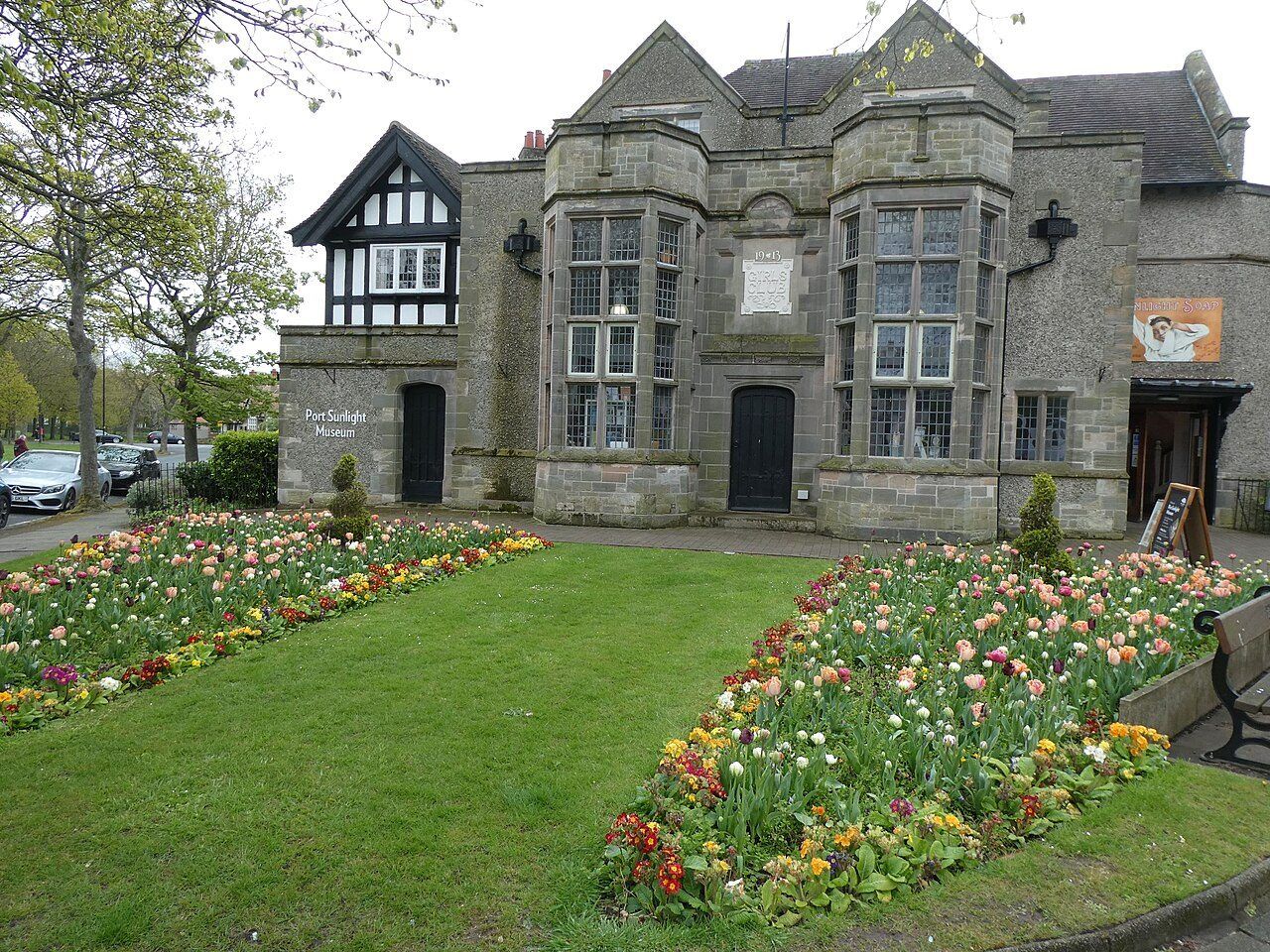 Port Sunlight Museum with spring flowerbeds in front