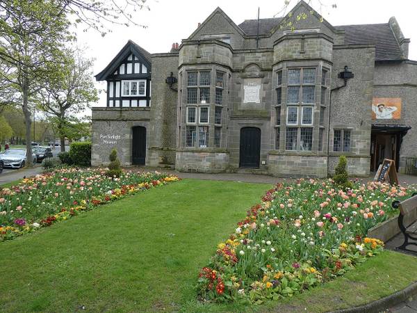 Port Sunlight Museum with spring flowerbeds in front